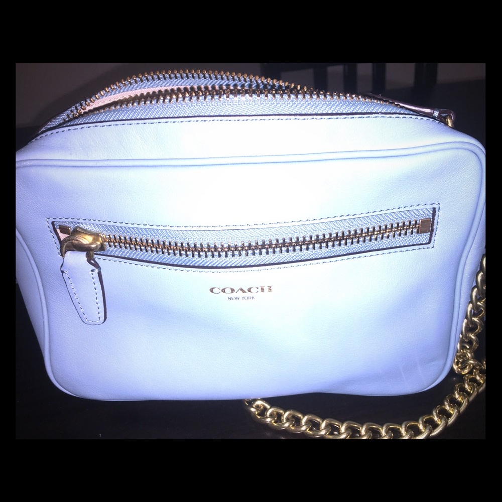 Coach front zipper bag in light blue.